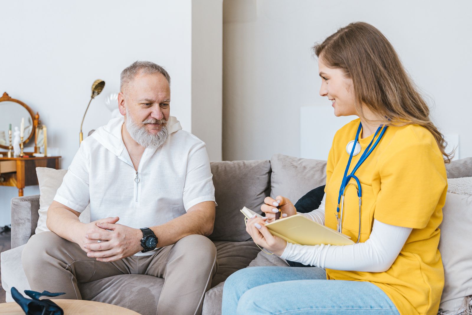 A clinician talking with an older patient during an unhurried visit