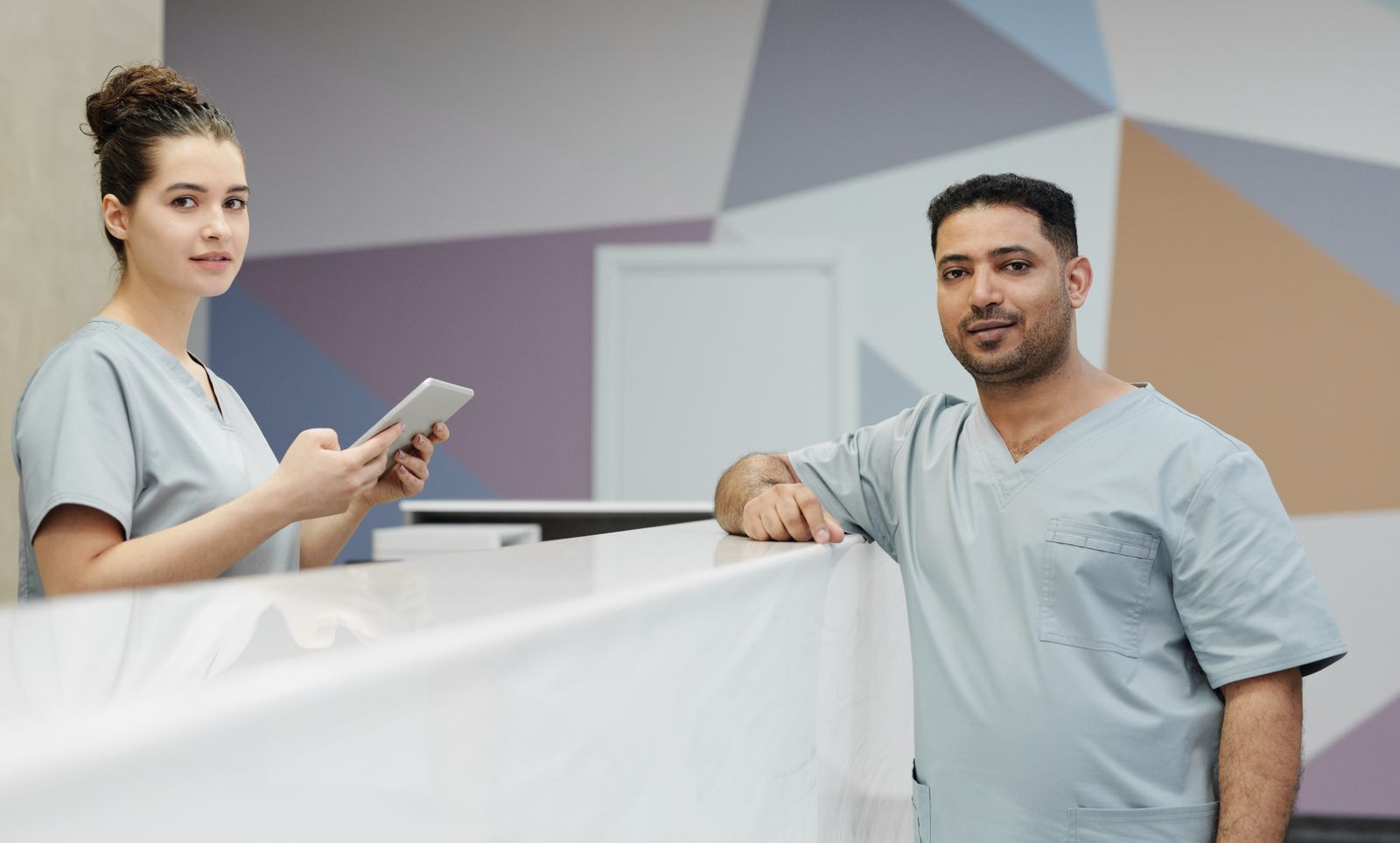Clinical staff at the front desk of a medical office